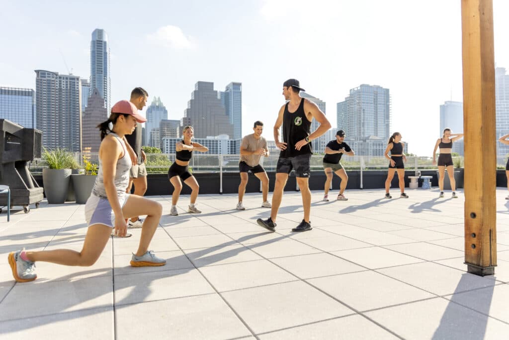 Training outdoors with kettlebells beside the trailer
